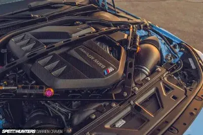 The hood and engine components of BMW M2